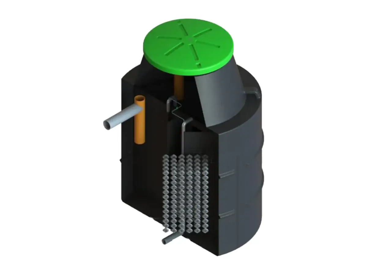 Vue en coupe de la micro-station Oxtec : les compartiments de la cuve et les supports en polypropylène du réacteur